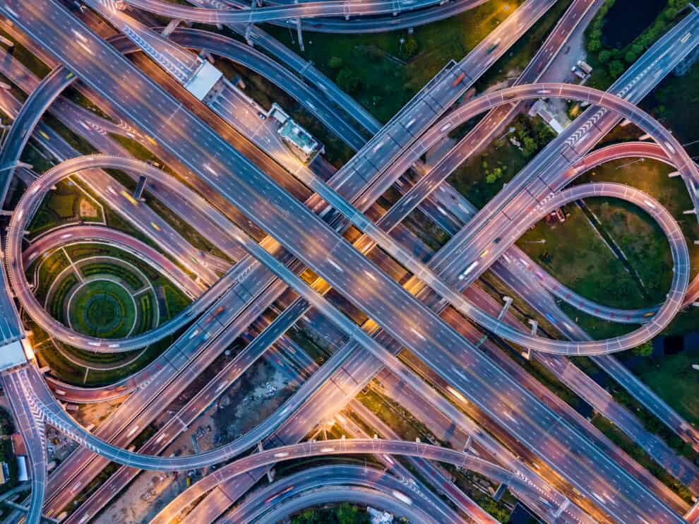 top-view-of-highway-road-junctions-at-night-the-intersecting-freeway-road-overpass-the-eastern-outer-ring-road-of-bangkok-thailand