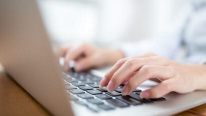 woman-hand-typing-on-laptop-keyboard