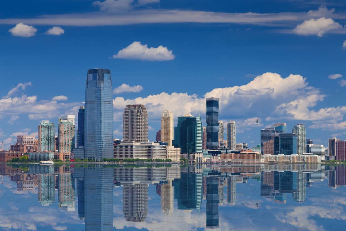 jersey-city-skyline-with-goldman-sachs-tower-reflected-in-water-of-hudson-river-new-york-usa