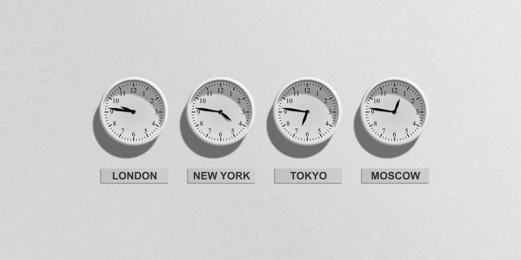 Four clocks set to different timezones.