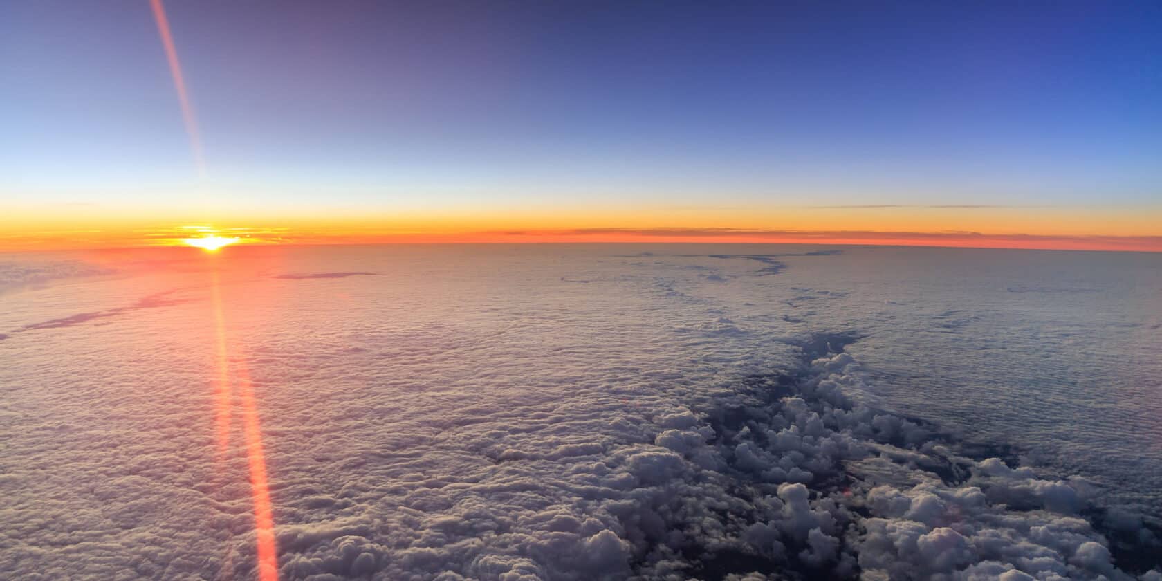 An aerial sunrise on clouds.