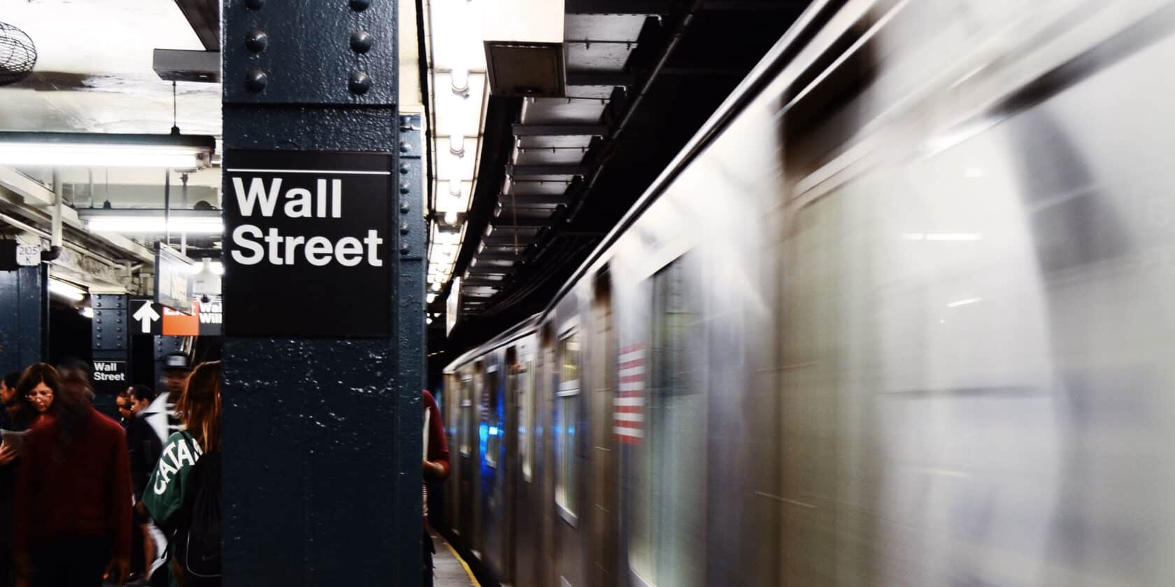 Wall Street sign at a New York subway station.