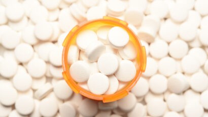 prescription-bottled-filled-with-pills-surrounded-by-more-of-the-same-tablets