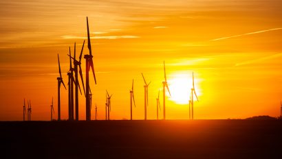 kansas-wind-farm-with-agriculture-at-sunset