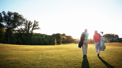 Pair of golfers walking to the next hole on the course.