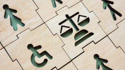 Icons carved into interlocking wooden tiles.