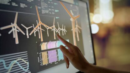 Individual interacting with a screen showing energy climate information