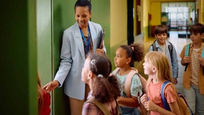 image of teacher with students