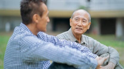 Two generations of family sitting together discussing wealth stewardship