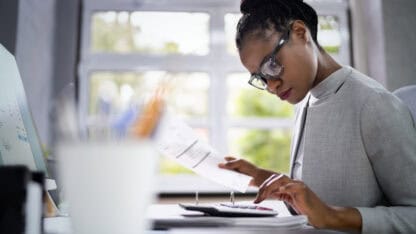 Auditor at work reviewing and preparing documents