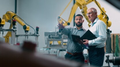 CFO have a discussion at a manufacturing company facility