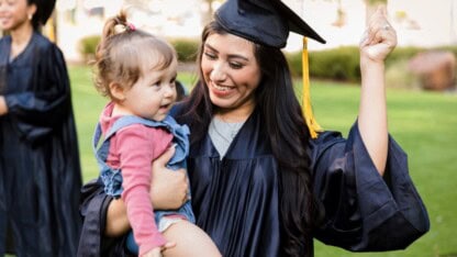 image of woman with baby graduating