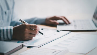 State and local government employees working with graphs and documents from external auditors