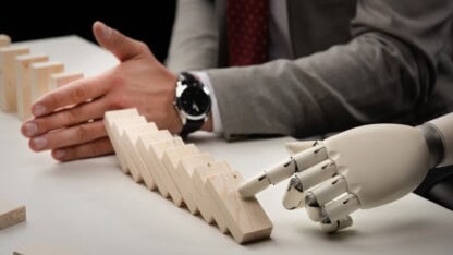 image of human arm and robotic arm