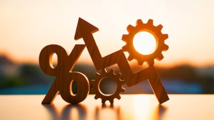 Arrows, percentages, and gears representing changes in business interest deductions under the new tax law