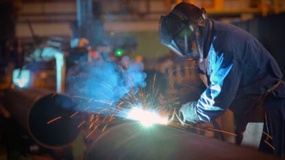 Workers at a metal fabrication company