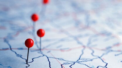 Image of pins in a map representing the varying state tax laws