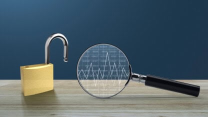 A unlocked padlock side-by-side with a magnifying glass.