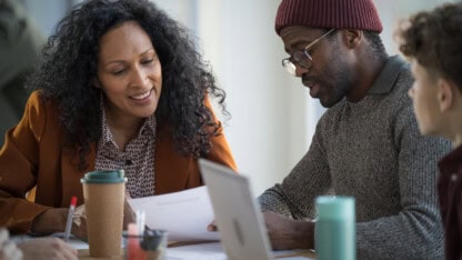 Female entrepreneur leading team discussion on growth strategies