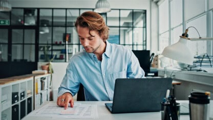 State government entity employee in office with laptop, checklist and preparation of financial statement