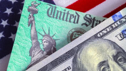 Image showing United States flag, dollar bill, Statue of Liberty, representing changes to IRS funding and tax impact