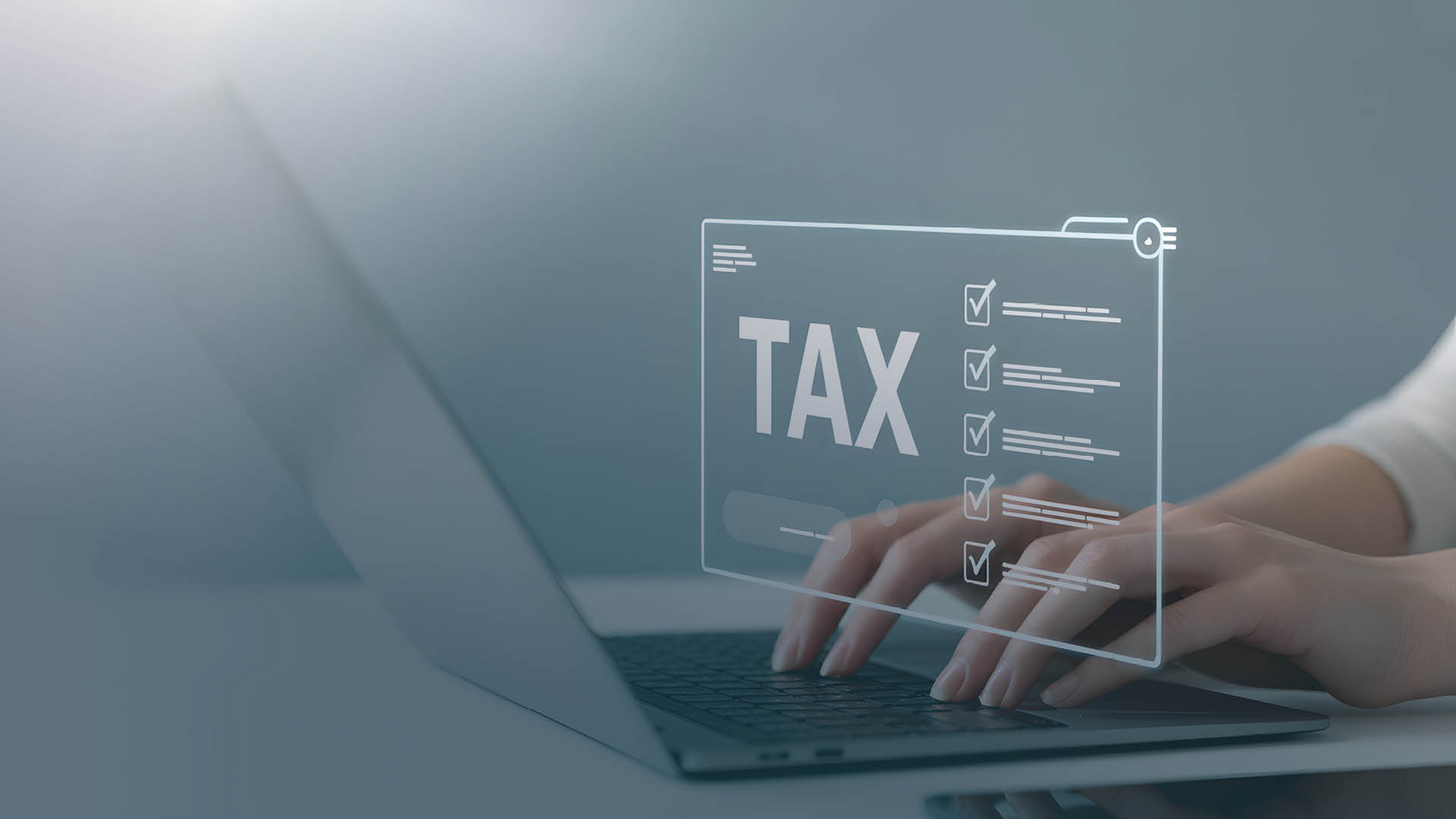 Hands typing on computer, sorting out taxable and nontaxable compensation
