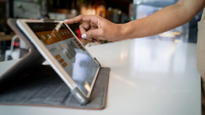 Close-up on a business manager using a digital tablet.