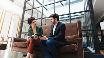Two professionals discussing a business sale
